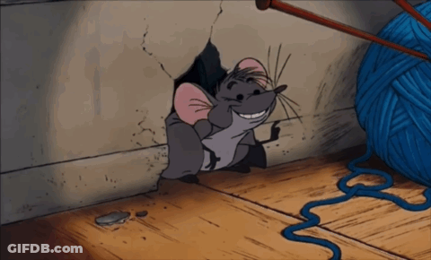 Cartoon Mouse Smiling In Hole Next To Yarn GIF