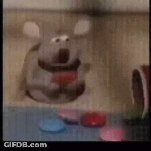 Cartoon Mouse With Red Heart Sitting On Table GIF