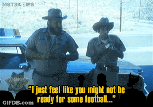 Cartoon Penguin Standing By Football GIF