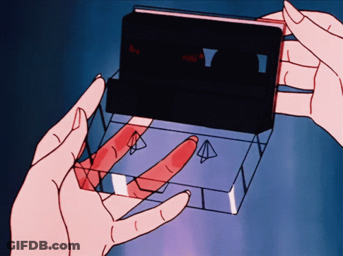 Cartoon Person Holding Cassette Tape Saying A GIF