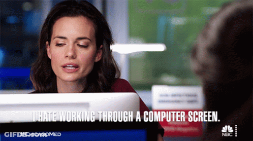Cartoon Person Sitting At Desk With Two Laptops GIF