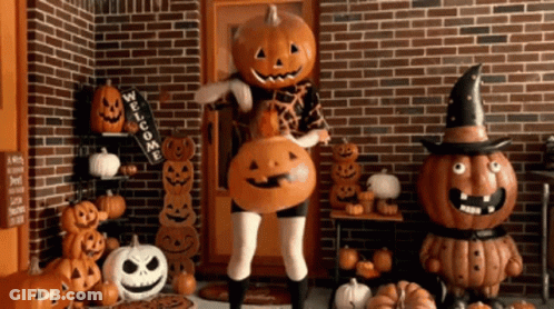 Cartoon Pumpkin Head Holding Pumpkin Spice Coffee GIF