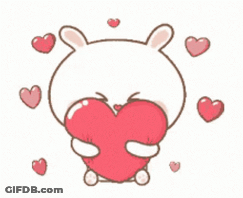 Cartoon Rabbit Holding Red Heart Surrounded By Hearts GIF