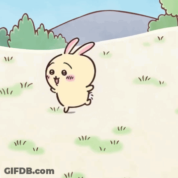 Cartoon Rabbit In Grass With Mountain GIF