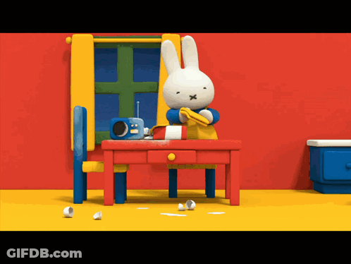 Cartoon Rabbit Sitting At Table GIF