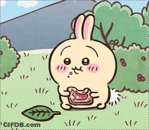Cartoon Rabbit Sitting In Grass Eating GIF