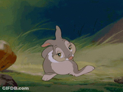 Cartoon Rabbit Standing In Grass With Eyes Closed GIF