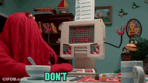 Cartoon Sitting At Table With Cereal And Don't Touch Sign GIF