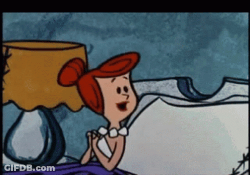 Cartoon Sitting On Bed With Lamp GIF