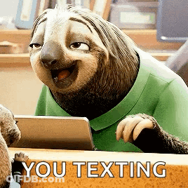 Cartoon Sloth Sitting At Desk Smiling GIF