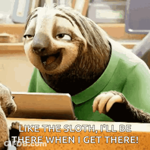 Cartoon Sloth Sitting At Table With Tablet Saying I'll Be There GIF