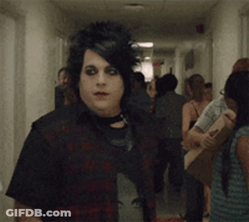 Cartoon Smiley Face Standing In Darkness GIF