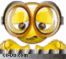 Cartoon Smiley Face Wearing Glasses And Goggles On Keyboard GIF