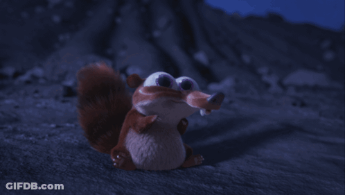 Cartoon Squirrel Sitting At Night GIF