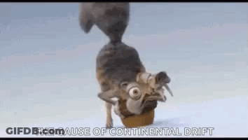 Cartoon Squirrel Standing In Snow Eating GIF