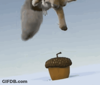 Cartoon Squirrel Standing On Acorn In Snow GIF