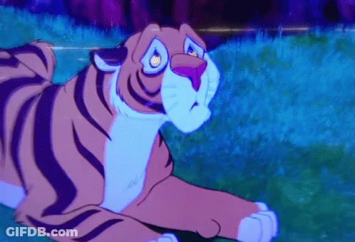 Cartoon Tiger Laying In Grass GIF