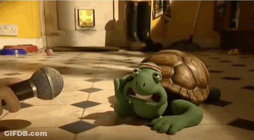 Cartoon Turtle Lying With Microphone GIF