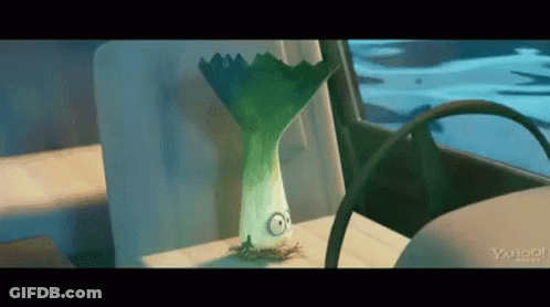 Cartoon With Leeks Head Sitting In Back Seat Of Car GIF