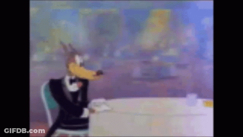 Cartoon Wolf In Tuxedo And Bow Tie GIF