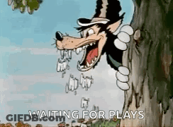 Cartoon Wolf Peeking From Tree Waiting For Plays GIF
