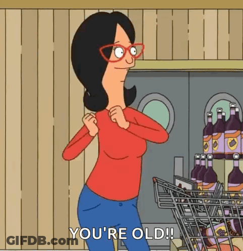Cartoon Woman Standing Next To Shopping Cart GIF