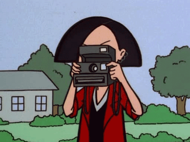 Cartoon Woman Using Polaroid Camera GIF