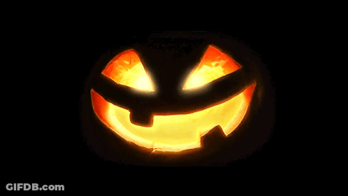 Carved Halloween Pumpkin With Glowing Face GIF