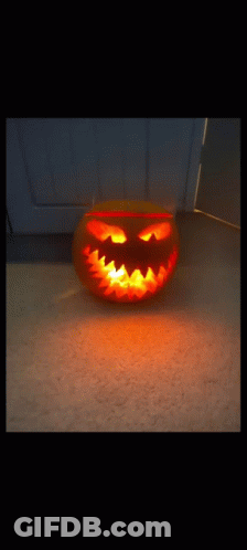 Carved Pumpkin With Glowing Face And Teeth GIF