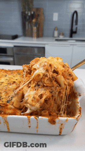 Casserole Dish With Pasta And Cheese And Spoon GIF