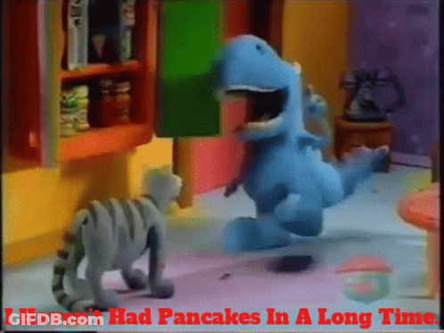 Cat And Dinosaur Saying I Haven't Had Pancakes In A Long Time GIF