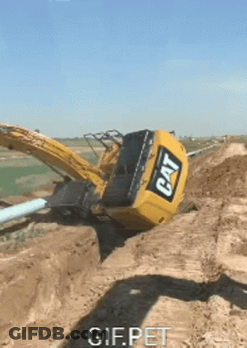 Cat Excavator Stuck In Dirt GIF