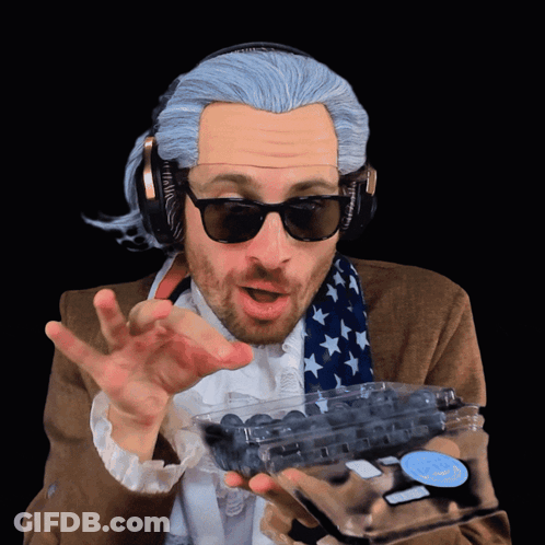 Cat Face With Blueberries And Green Leaf GIF