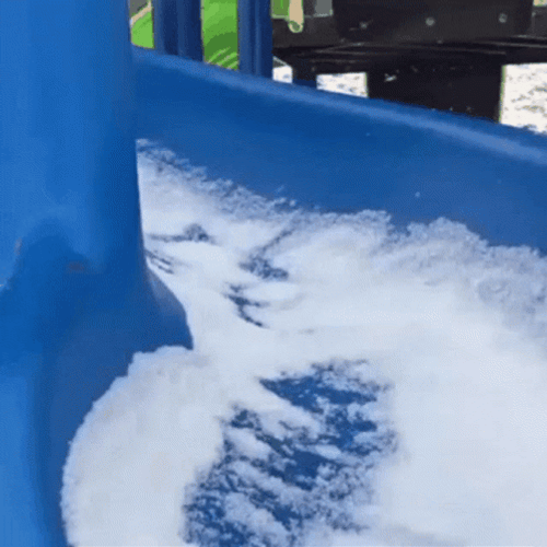 Cat Going Down On Snow Covered Slide GIF
