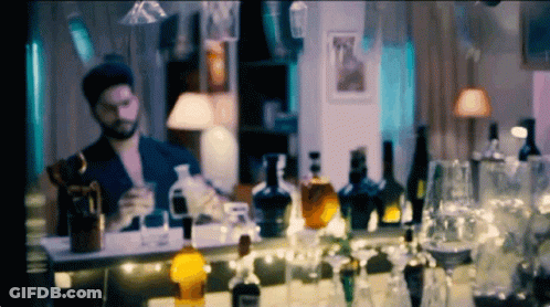 Cat In Hat And Bow Tie Pointing At Camera GIF