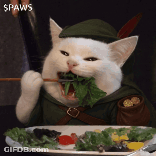 Cat In Robin Hood Costume Eating Lettuce GIF