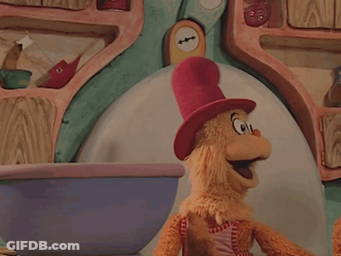 Cat In The Hat Puppet Hugging Stuffed Animal GIF