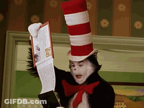 Cat In The Hat Reading Book Holding Magazine GIF