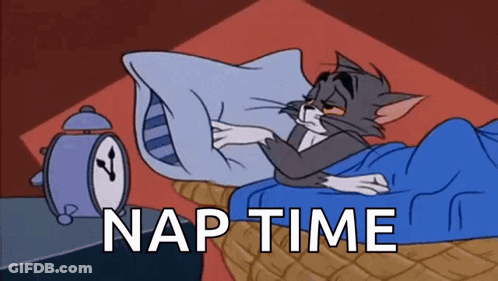 Cat Laying In Bed Next To Alarm Clock Saying Nap Time GIF