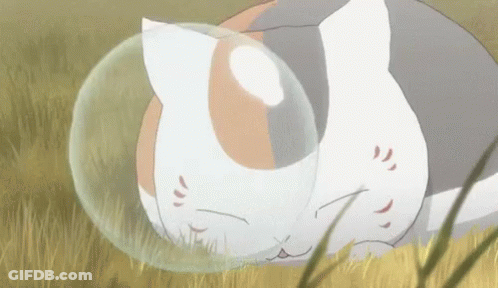 Cat Laying In Grass With Bubble Around Head GIF