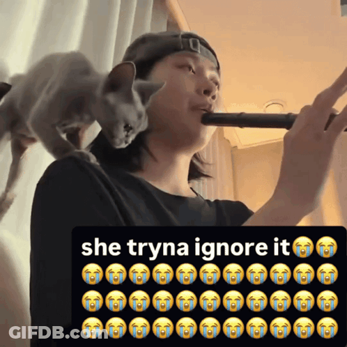 Cat On Man's Shoulder Saying She Tryna Ignore It GIF