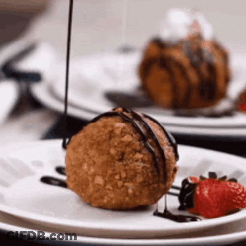 Cat Shaped Pudding With Whipped Cream And Cherry GIF