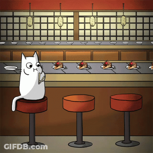 Cat Sitting On Bar Stool At Conveyor Belt With Cakes GIF