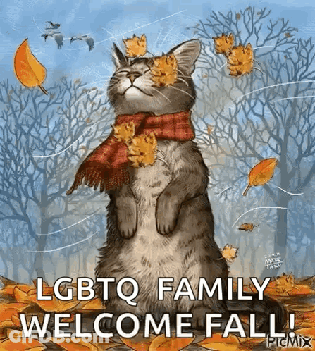 Cat Wearing Scarf With Leaves In Woods GIF