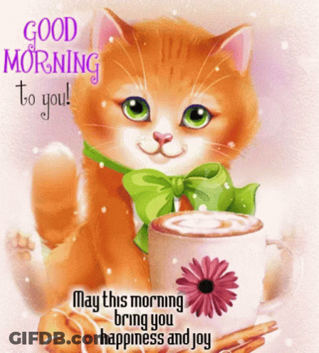 Cat With Green Bow Sitting Next To Coffee With Flower GIF