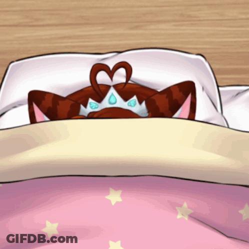 Cat With Heart Crown Laying On Bed GIF