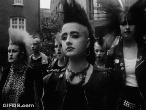 Cat With Mohawk And Leather Jacket Says Hello GIF