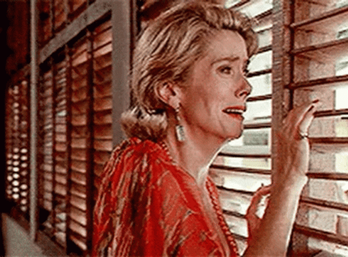 Catherine Deneuve Looking Out The Window GIF