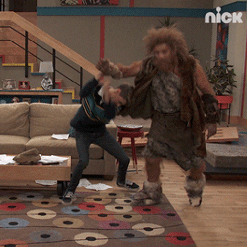 Caveman And Modern Guy Wrestling GIF