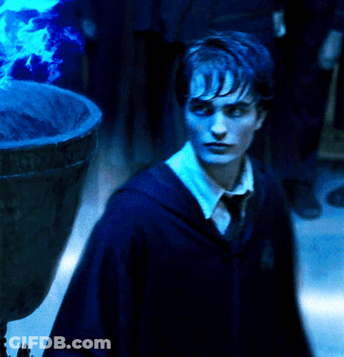 Cedric Diggory Touching Blue Fire GIF